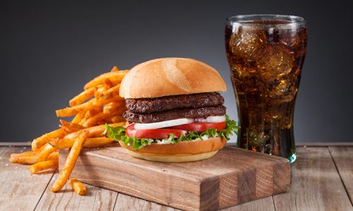 The New Miami Subs Grill offers National Burger Day Burger Special