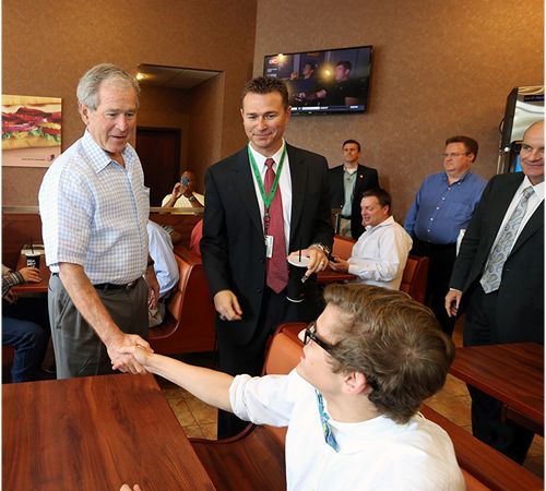 Former President George W. Bush Shares a Sandwich, Advice With Carroll Senior High Students