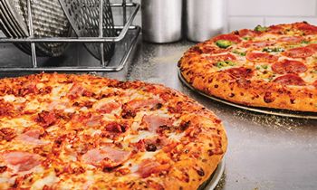 Basketball Fans Can Score Big With 50 Percent Off Domino’s Pizza