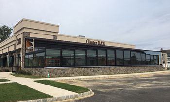 Cinder Bar’s Roll-A-Cover Retractable Patio Enclosure Opening Soon
