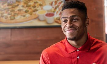 University of Wisconsin Running Back and NFL Hopeful Jonathan Taylor Tackles Next Venture as Franchisee of Toppers Pizza