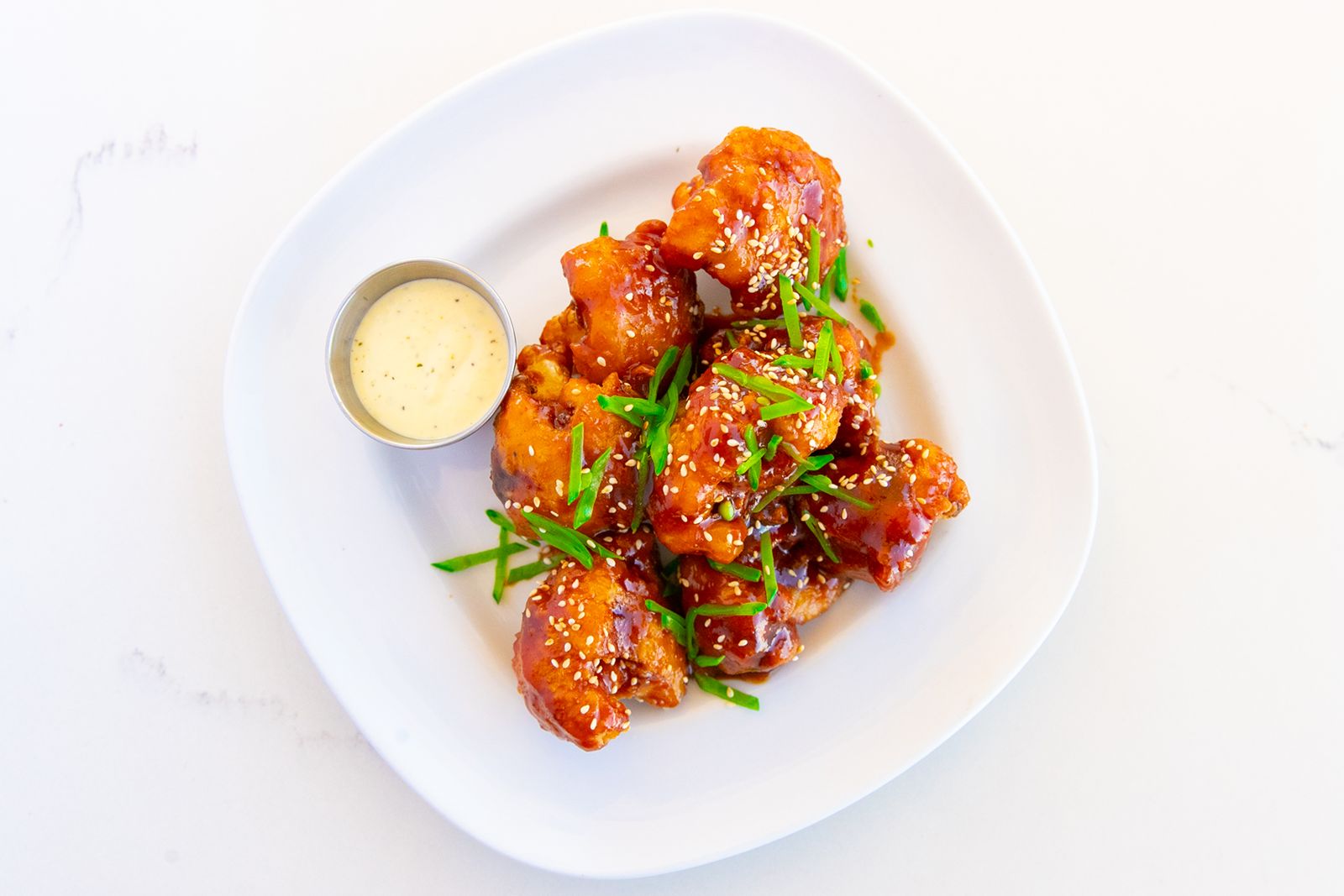 bellagreen's Spring Seasonal Menu Blooms with New Flavors bellagreen Honey Garlic Cauliflower Wings