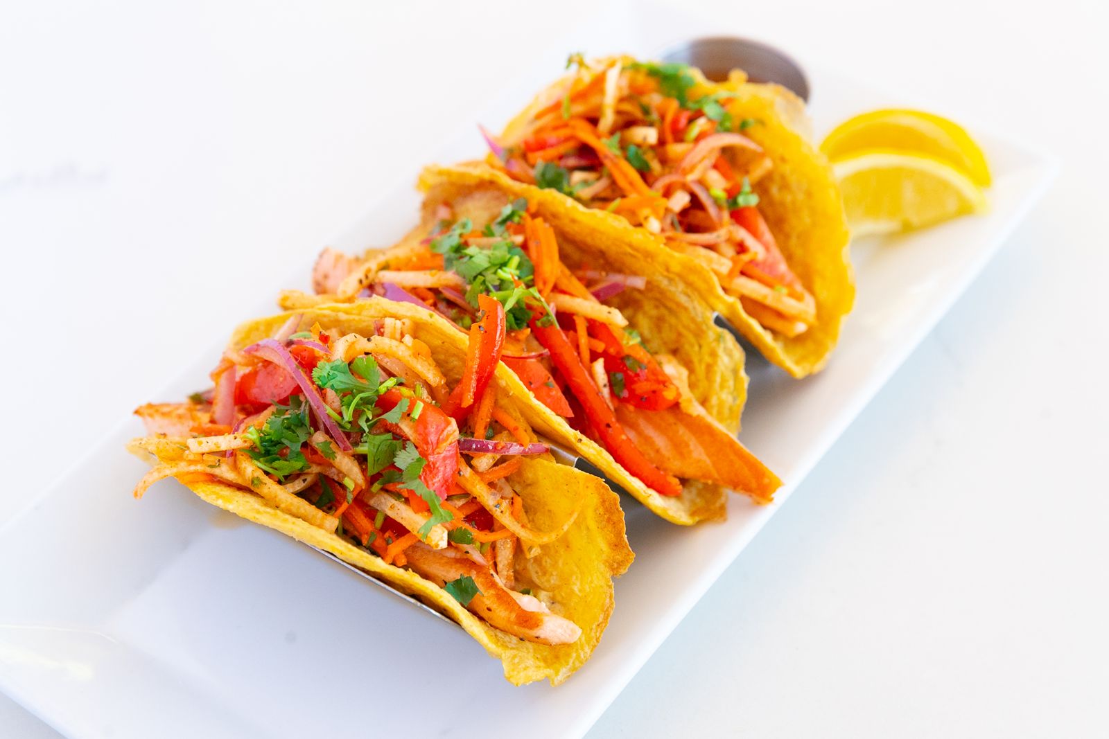 bellagreen Rainbow Slaw Paleo Salmon Tacos bellagreen's Spring Seasonal Menu Blooms with New Flavors