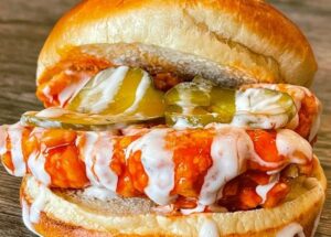 Turn Up the Heat with Crave Hot Dogs & BBQ’s Latest LTO – The Buffalo Chicken Sandwich!