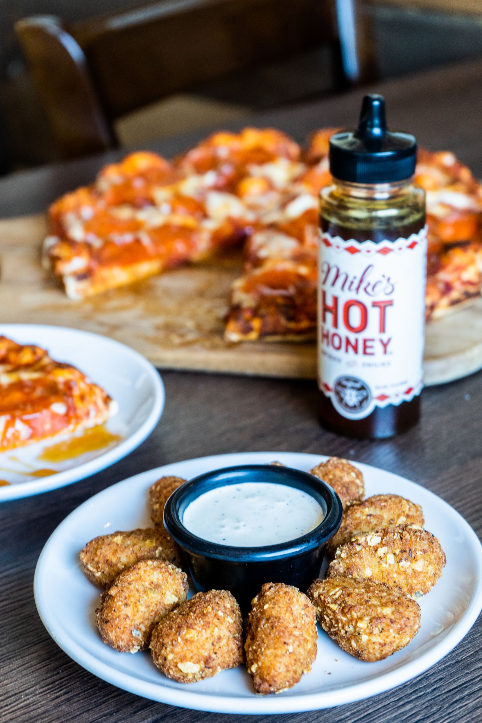 Spice Up Your Next Meal with Mike's Hot Honey and Queso Loaded Tots at Straw Hat Pizza Spice Up Your Next Meal with Mike's Hot Honey and Queso Loaded Tots at Straw Hat Pizza