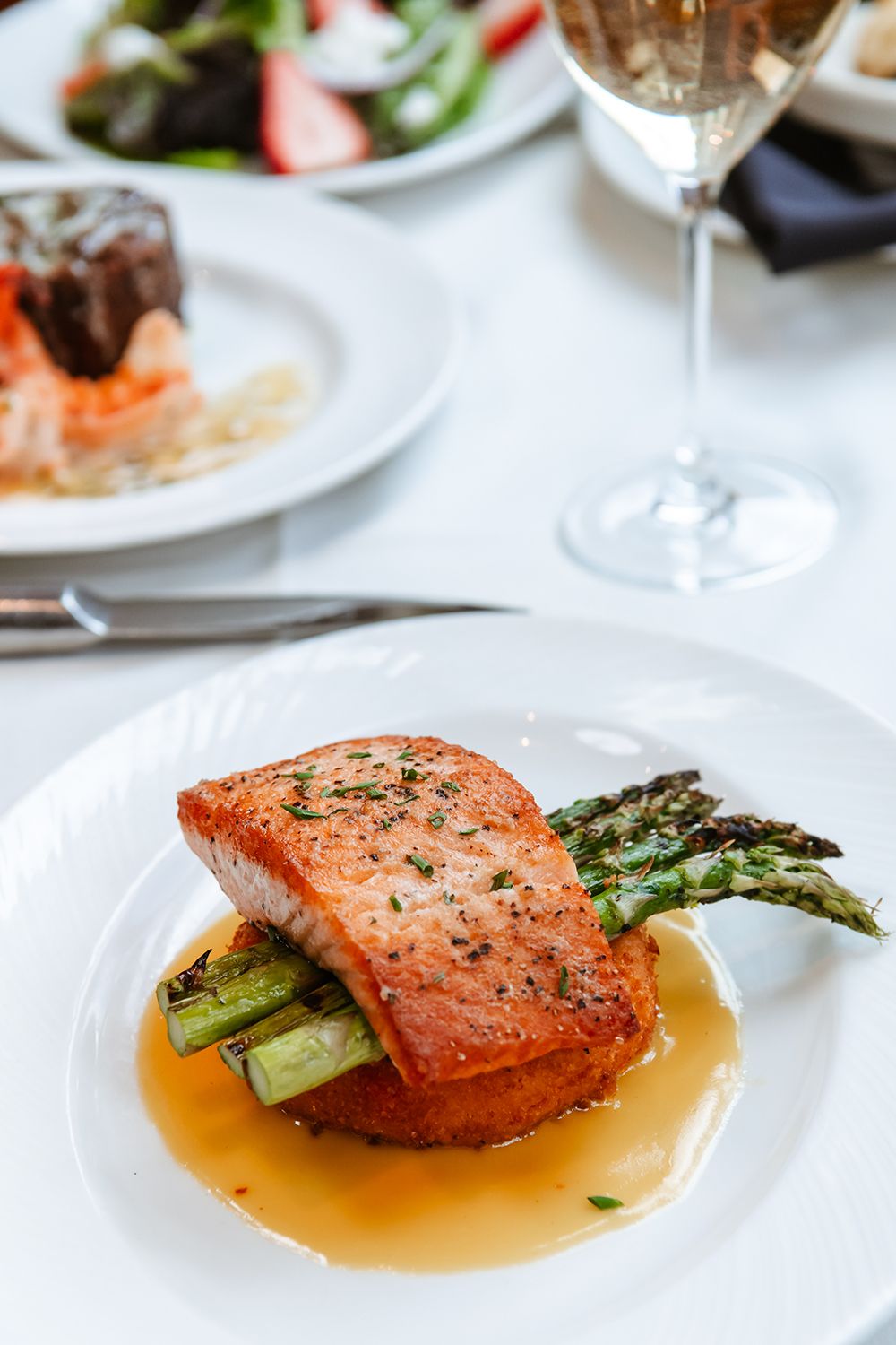 Eddie Merlot's Pan-roasted Salmon with Crispy Lobster Risotto Cake Eddie Merlot's Unveils Sophisticated Summertime Menu with Fresh Off The Grill Features