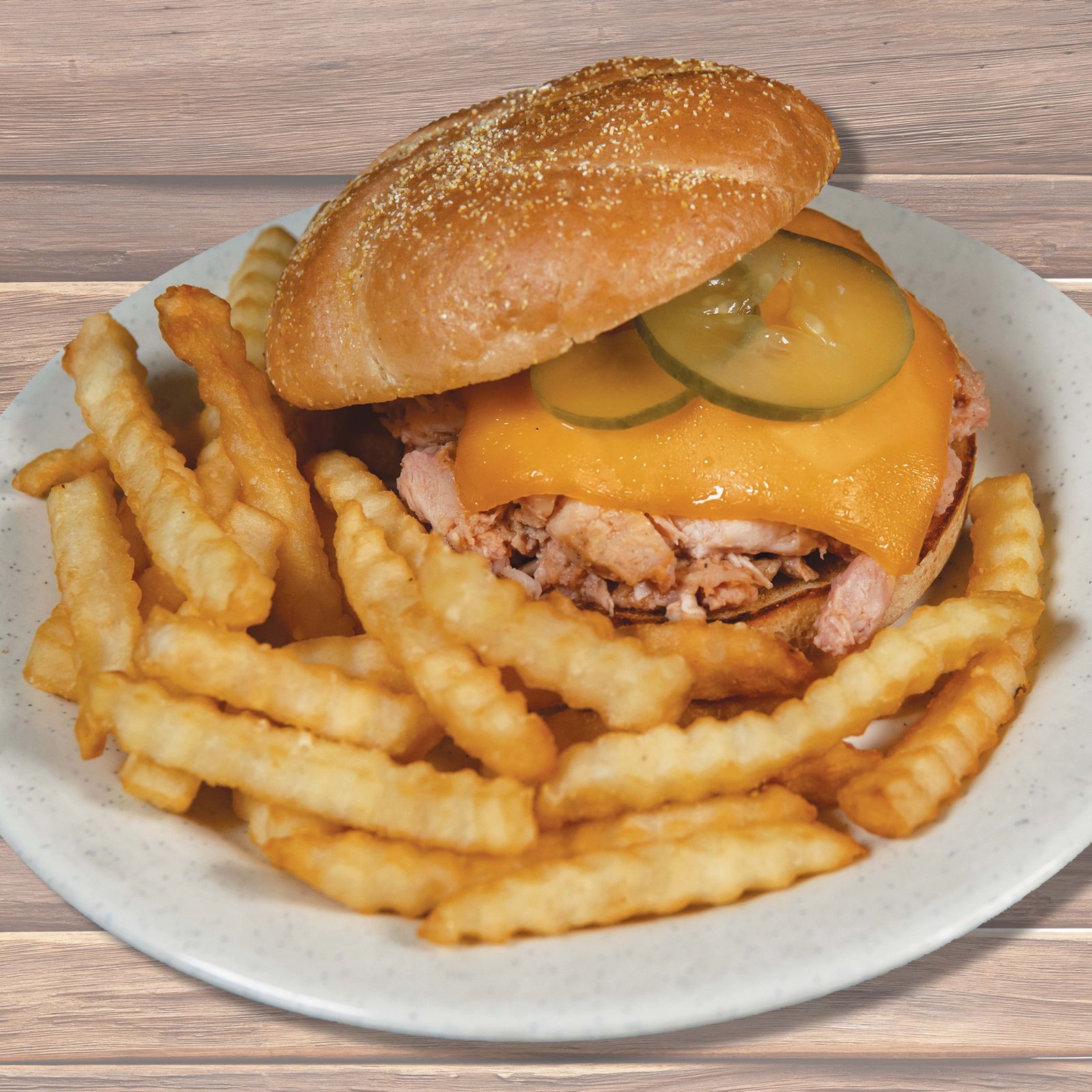 Woody's Bar-B-Q The Handheld Hen Woody's Bar-B-Q Queues Up a Hen Vs. Heifer Summer Smackdown
