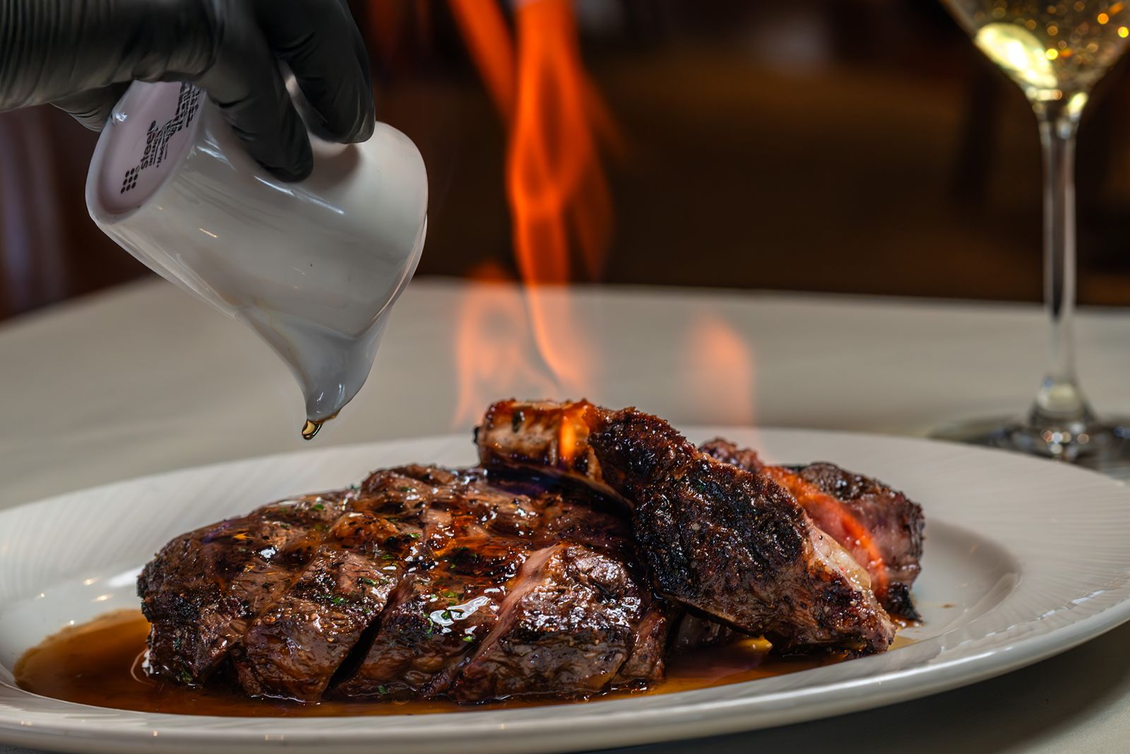 Eddie Merlot's Grills Up New Limited-Time Menu for Summer Eddie Merlot's Bone-In Ribeye Flambé