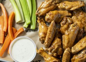 East Coast Wings + Grill Names Top 3 Fan Flavor Showdown Finalists as Voting Opens and Summer Escape Menu Launches